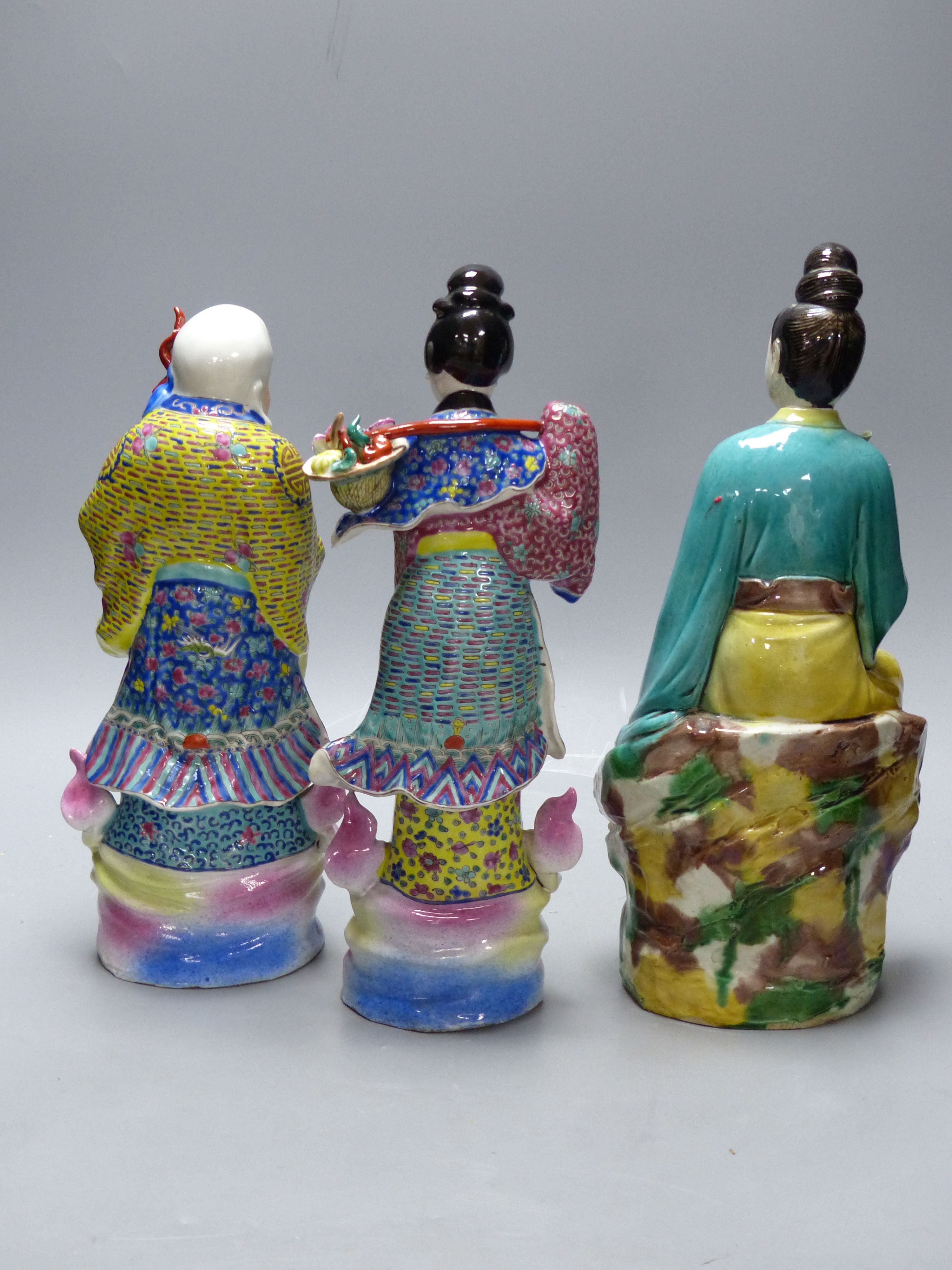 Three Chinese ceramic figures, late Qing, tallest 32cm